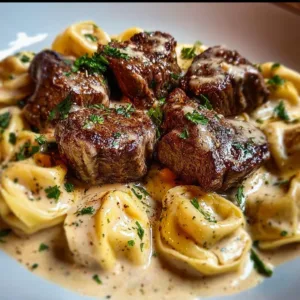 Cracked Garlic Steak Tortellini served in creamy sauce, a delicious pasta dish.