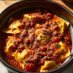 Delicious Crockpot Ravioli Lasagna garnished and served in a bowl