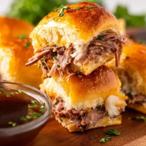 Delicious French Dip Sliders served with au jus for dipping