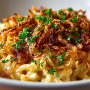 French Onion Chicken Orzo Casserole topped with melted cheese and crispy onions