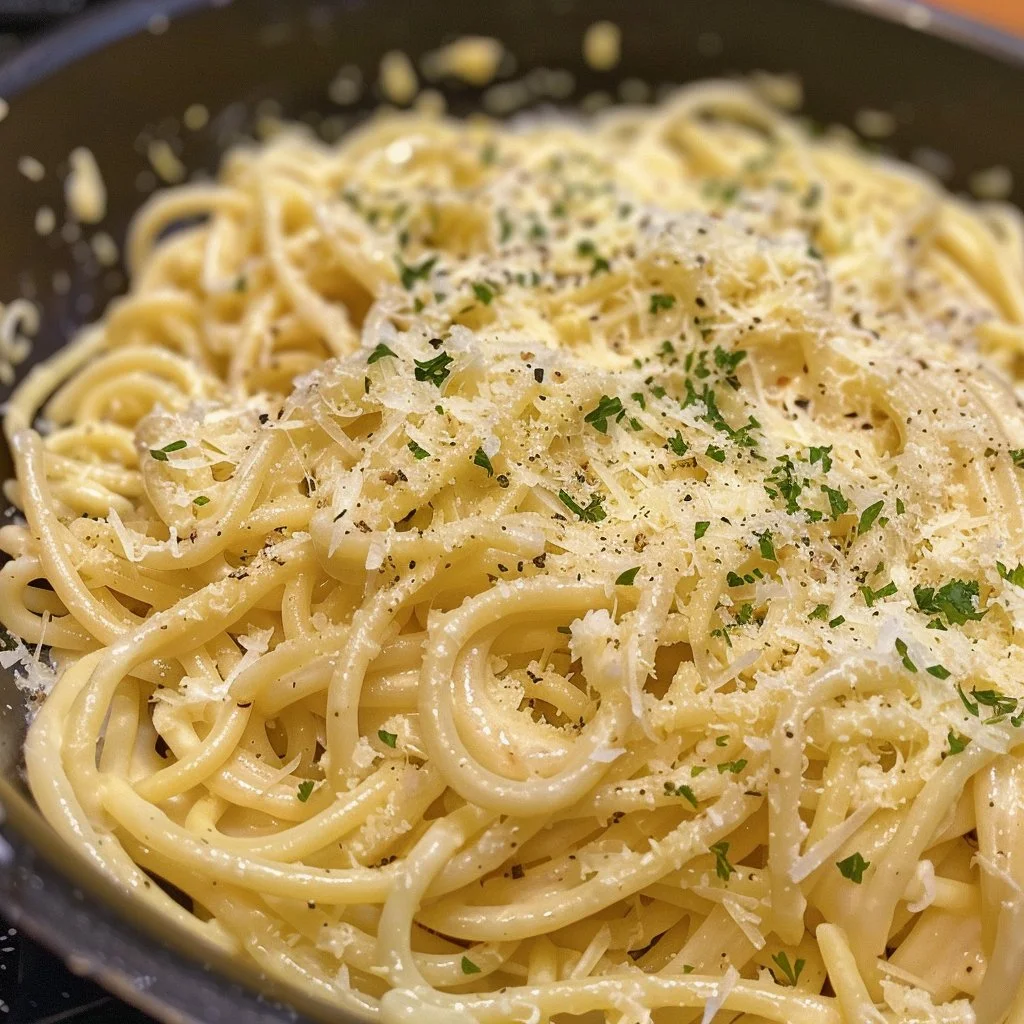 Creamy one-pot garlic parmesan pasta served in a bowl with parsley.